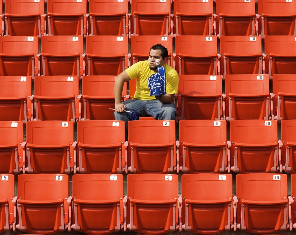 Sports Fan in Empty Stadium
