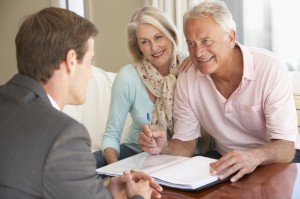 Senior or boomer couple with REALTOR 